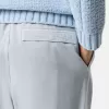Weit geschnittene Jogginghose mit Druckknopf- und Reißverschlusstaschen